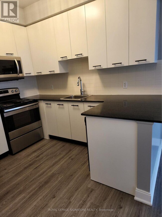 Photo - 135 Village Green Square Unit 623