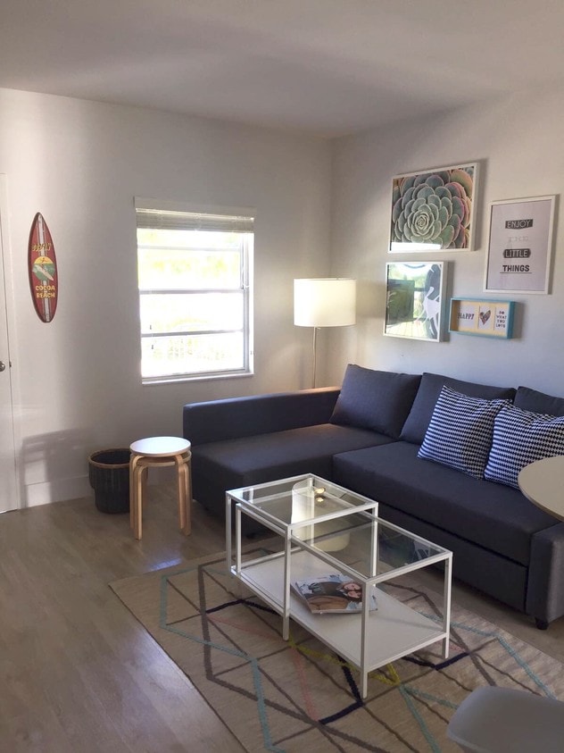 Living Room with Sofa Bed - Happy Livin'! Cool 2BR Furnished, Brand New,  Steps from UM  Campus!