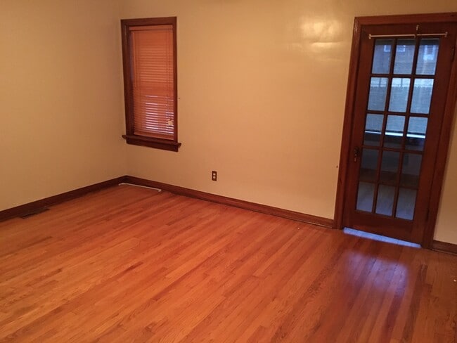 Bedroom 1. French door leads to Den / Sun Room.
