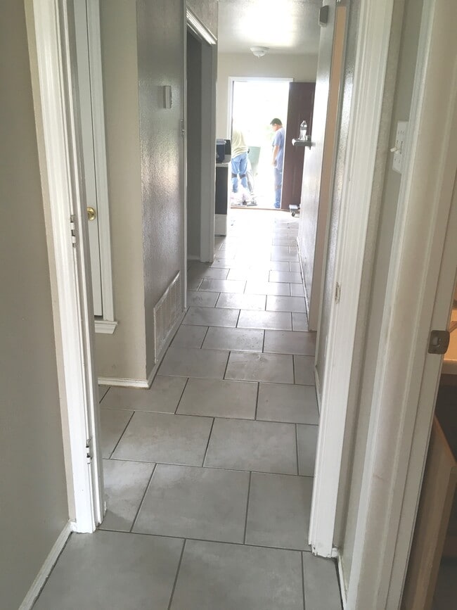 Contractors wrapping up the New flooring - 2200 Wright Way