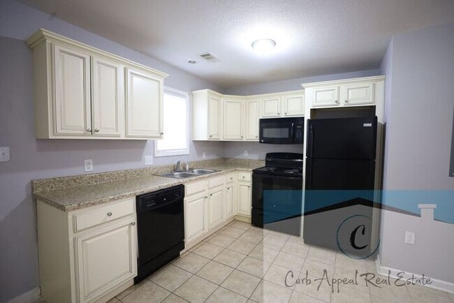 Photo - First month move in special $600!! Recently built 2 bed, 1 bath apartment - includes dishwasher a...