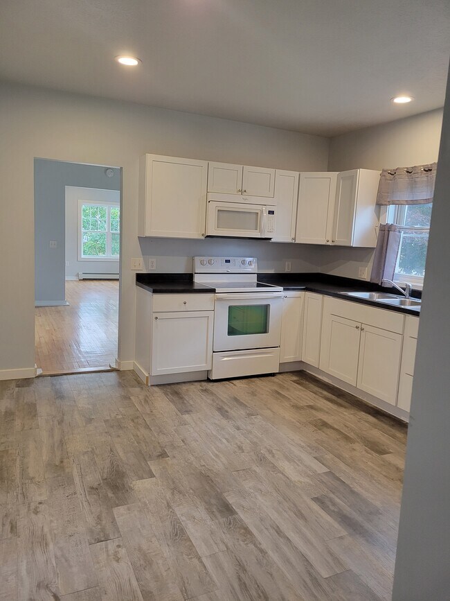 Glass top stove and microwave. - 322 S 14th St