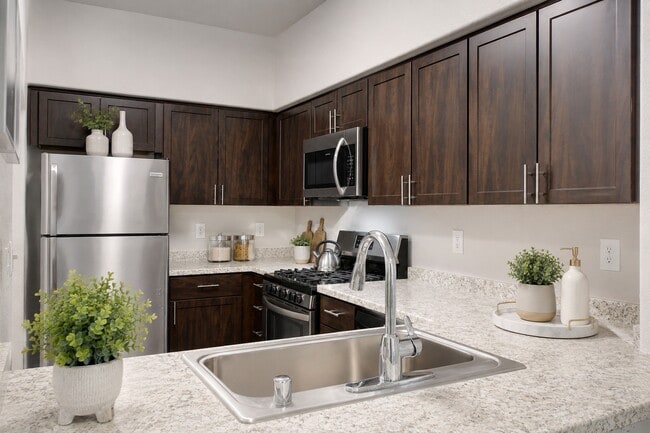 Elevate your culinary adventures in the stylish kitchen at Willowbrook, featuring modern appliances, sleek countertops, and ample cabinet space. Create meals with ease and enjoy your time at home. Join us at Willowbrook today!