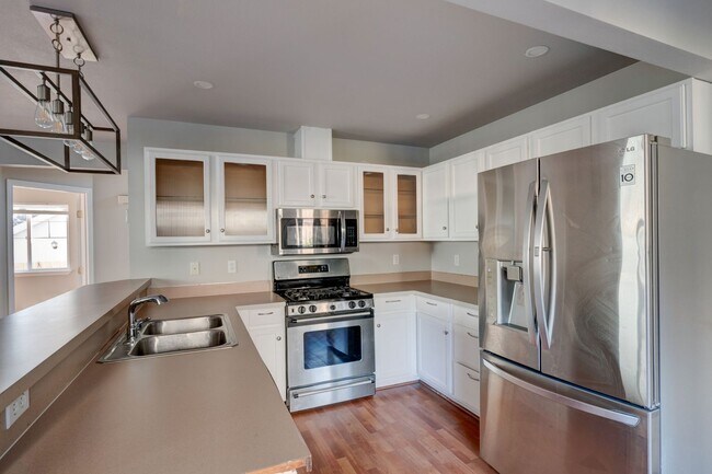 Photo - Spacious 4-Bedroom Home with Cozy Backyard...