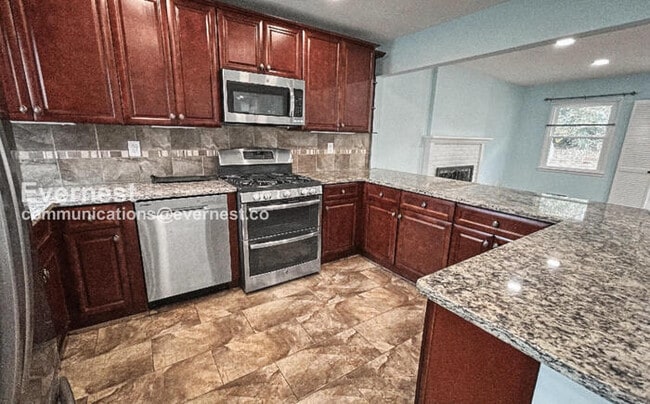 Photo - 3 Bed/3 Bath Home with Fenced Yard and Garage / Available Now!