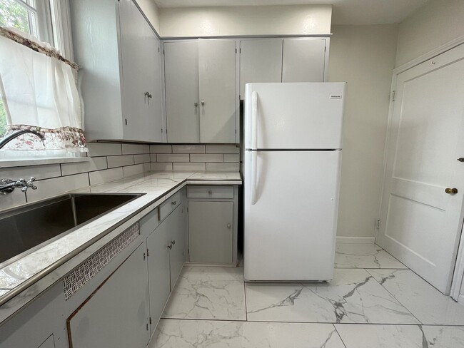 Photo - Spacious Multi-Level Living with Vaulted Ceilings and Backyard Access