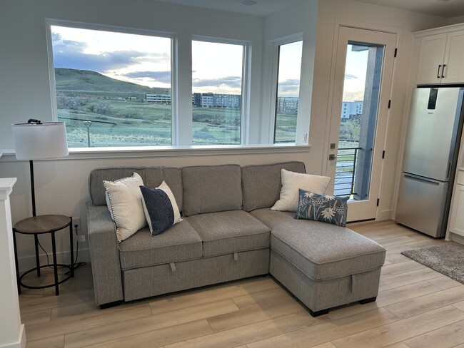 Family room faces open space - 11160 Vibrato Ln Apartment