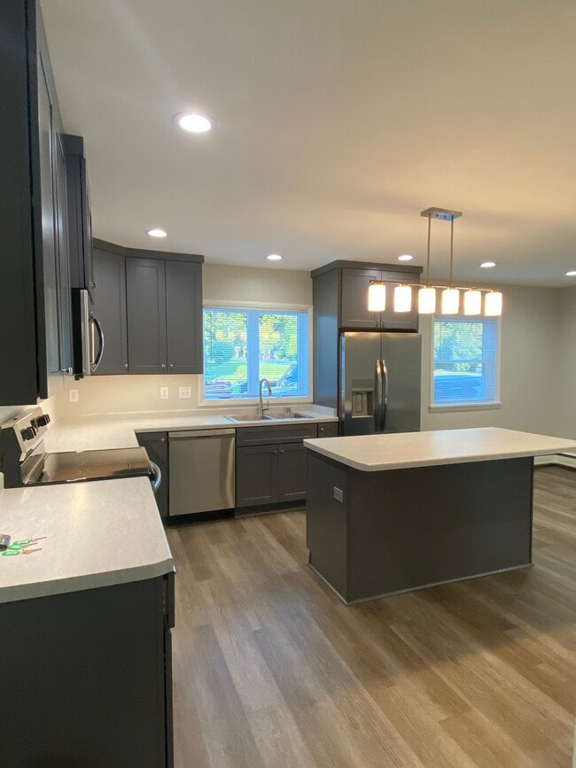 Kitchen w/ Island - 144 Main St Rental