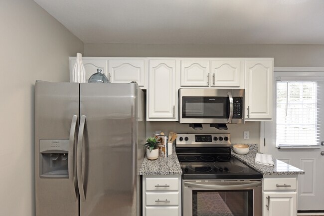 Kitchen with granite counters and stainless appliances