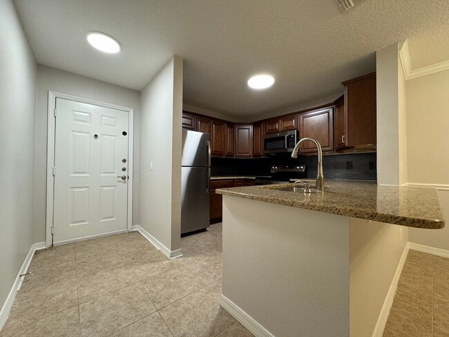 Photo - Oviedo 2/2 Condo with Tile & LVP Flooring, Updated Baths, New Paint & Appliances! Unit 104