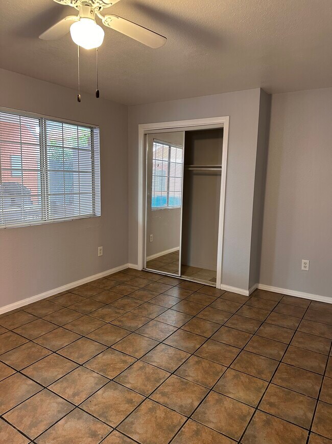 Living room with closet - 8018 Troost Ave