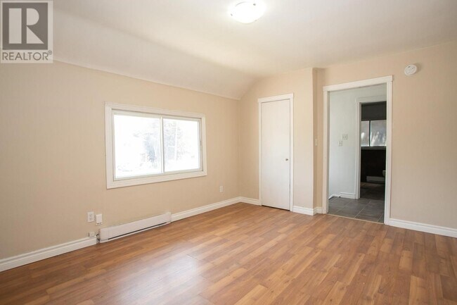 Photo - 2 Bedroom Upper-Level Unit – Parking & In-... Unit B