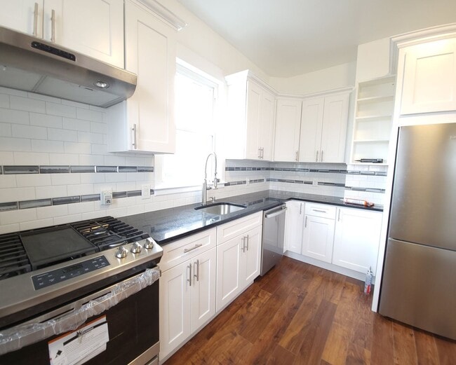 Photo - Renovated 3 Bed / 2 Bath in Allston | In-Unit Laundry | 9/1