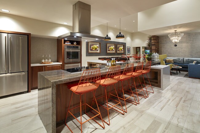 The Lounge featuring a bar area and TV's