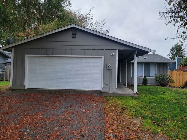 Photo - Spacious Spanaway rambler with covered patio and fenced yard.
