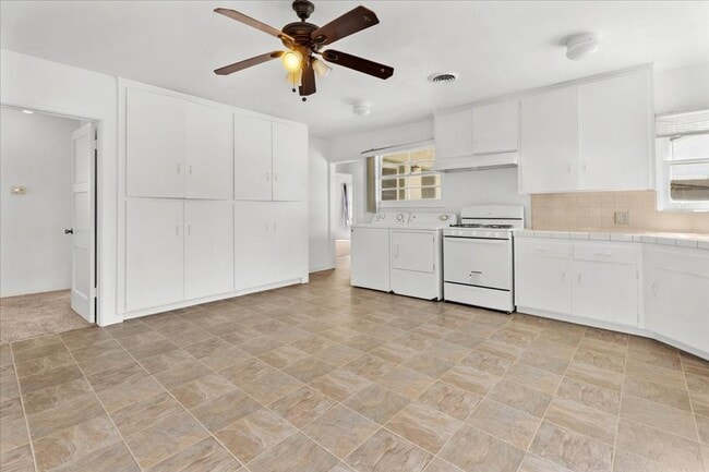 Photo - Spacious 4-Bed Home with Backyard, Garage & Prime Westside Access