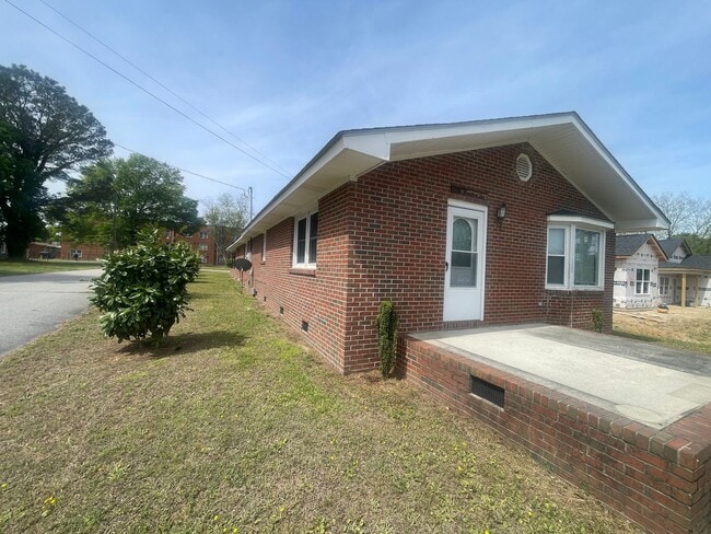 Photo - Brick Ranch- Dunn- 4 bedroom 2.5 bath- 2 car carport- Corner Lot