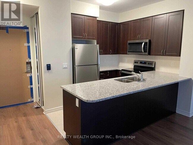 Photo - 349 Rathburn Rd W Unit 307