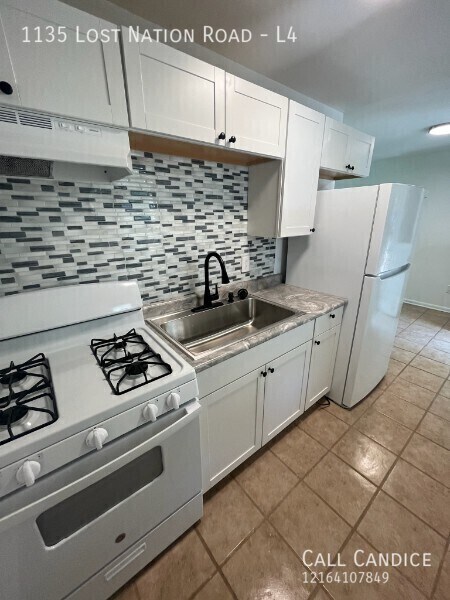 Building Photo - 1135 Lost Nation Rd Unit L4