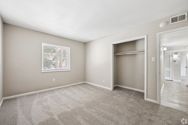 Step into your new sanctuary at The Preserve On Conley Apartments. This spacious bedroom features natural light, plush carpeting, and ample closet space for all your needs. Don't miss out—schedule your tour today to find your perfect home!