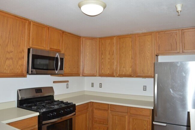 Photo - Spacious Three-Bedroom Two-Story Townhome with Garage and Private Yard