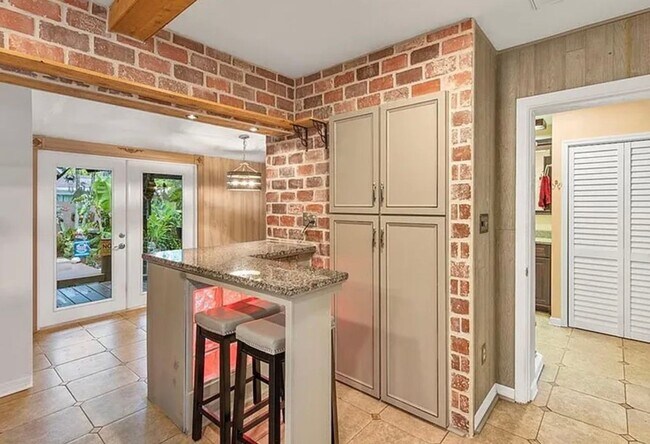 Photo - Charming 3-bedroom, 2-bath pool home available for move-in at the end of June.
