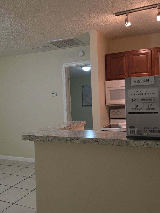 Photo - 1 bedroom, 1 bath; kitchen with microwave. Unit A