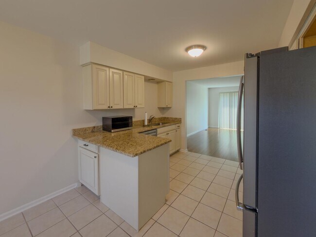Photo - Move-In Ready Ranch Condo with Basement & Prime Location