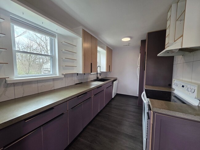 Photo - Charming 2BR with Walk-Out Basement, Fenced Yard & Flexible Murphy-Bed Office
