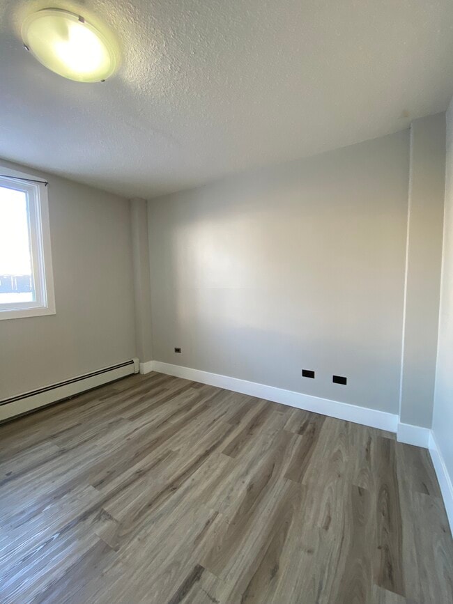 Photo - Cliff Bungalow Basement Unit – Open Layout, In-Unit Laundry, Prime Location Unit 103
