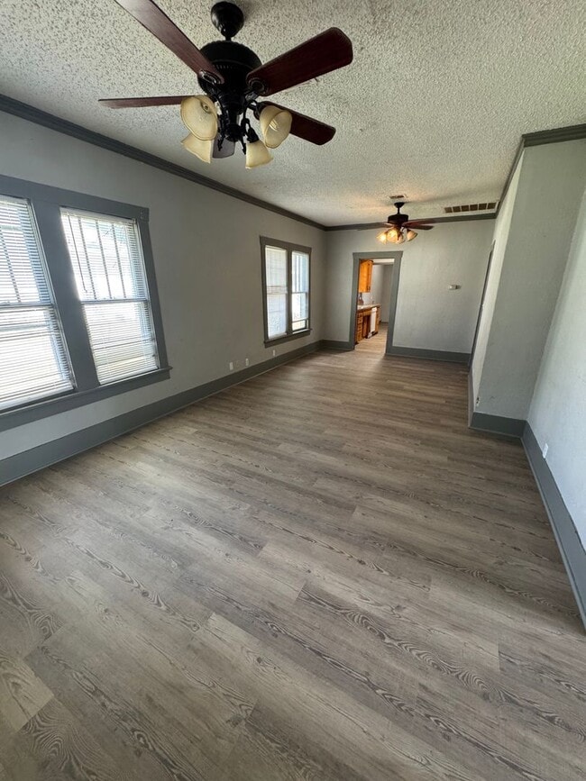 Photo - Three bedroom two bath home with central heat and air, large fenced backyard, and carport!