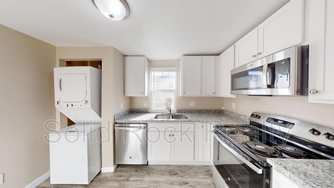 Building Photo - 2405 E St Vrain St Unit 103