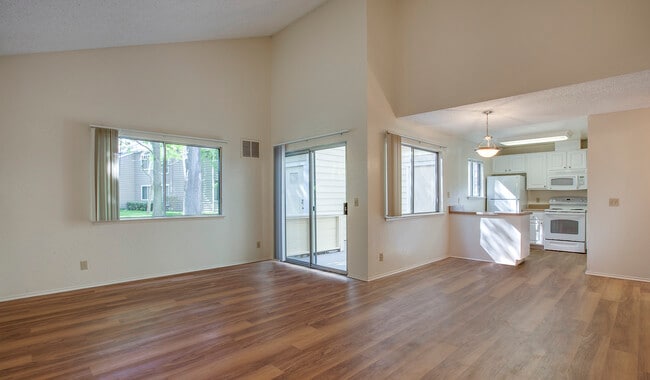 Spacious bedrooms with wood plank flooring - Mariners Cove Apartments