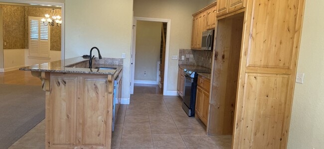 Photo - Wonderful brick home close to XNA boasting an upstairs and downstairs "primary" suite!