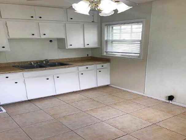 Updated kitchen w/ stainless appliances (not shown) and new counter and tile backsplash. - 1652 Humphrey Ave
