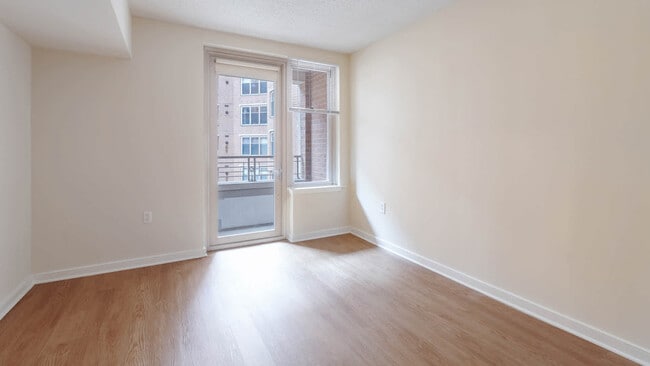Bedroom with Balcony and Hard Surface Flooring