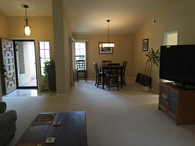 Dining room and front entryway. (kitchen area is to the right and bedrooms to the left in this view) - 2094 Balboa Cir