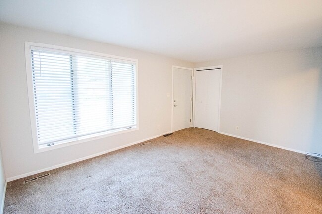 Photo - Ranch-style home with great fenced yard & patio!