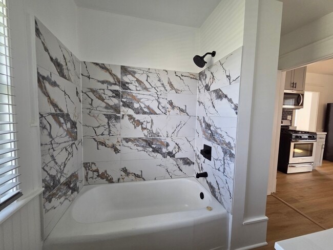 Bathtub and shower - 5706 22nd Ave Unit Upper