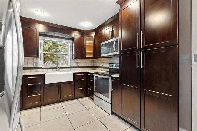 soft close, wood cabinets, - 6396 27th St N Unit Apt. B