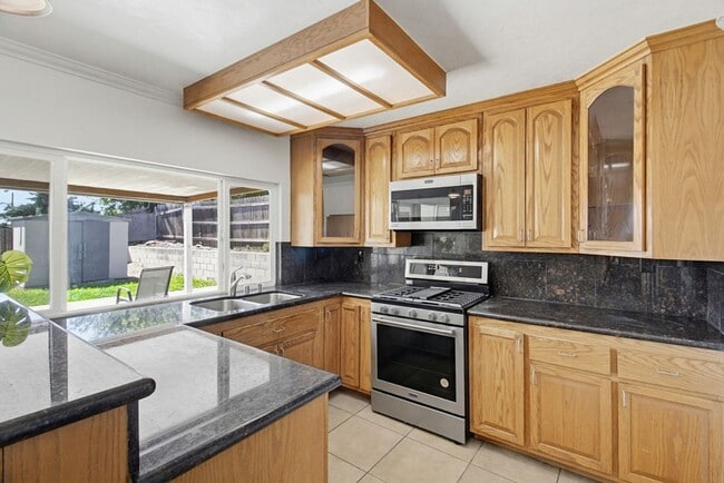 Photo - Single level, 4 bedroom, 2 bath home with 2 car garage and RV parking available now!