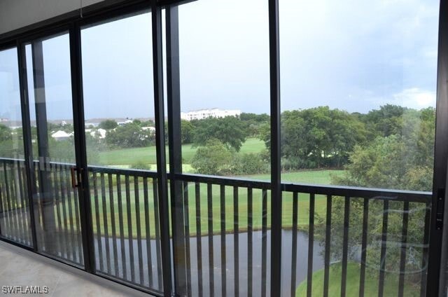 Building Photo - 7040 Pelican Bay Blvd Unit D404