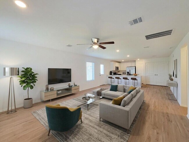 Photo - This single-story home has a comfortable layout with three bedrooms and a living area all on one ...