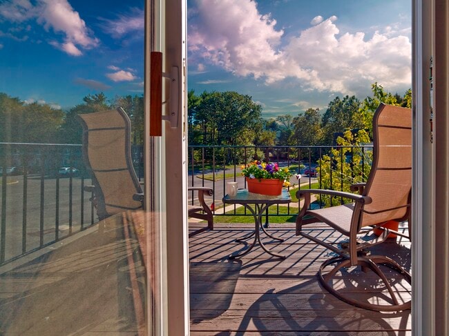 Relax outdoors on your private balcony at Haynes Run Apartments, offering peaceful views, fresh air, and space to unwind.