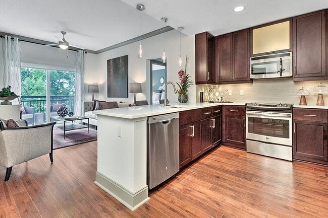 Kitchens with quartz countertops and stainless steel appliances