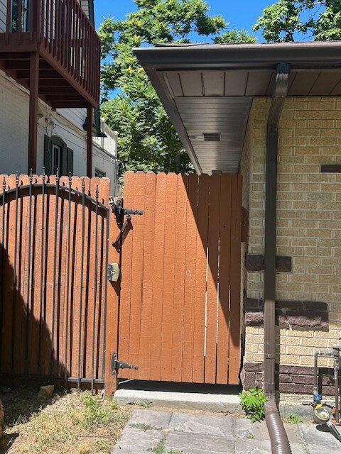 Enter through gate - 4571 Beach Ct Apartments Unit B