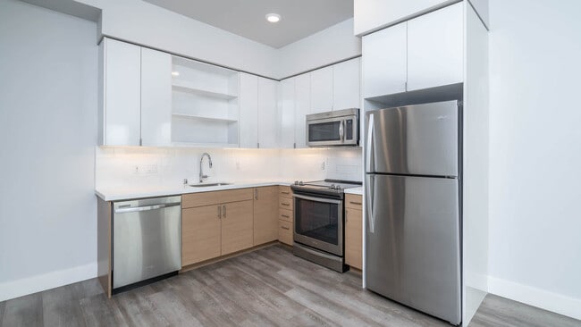 Kitchen with Stainless Steel Appliances and Quartz Countertops