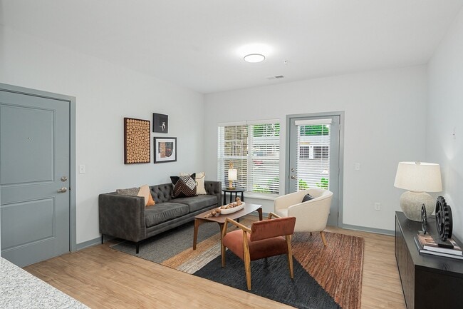 Living Room View with Private Outdoor Space - The Retreat at Canal Apartments
