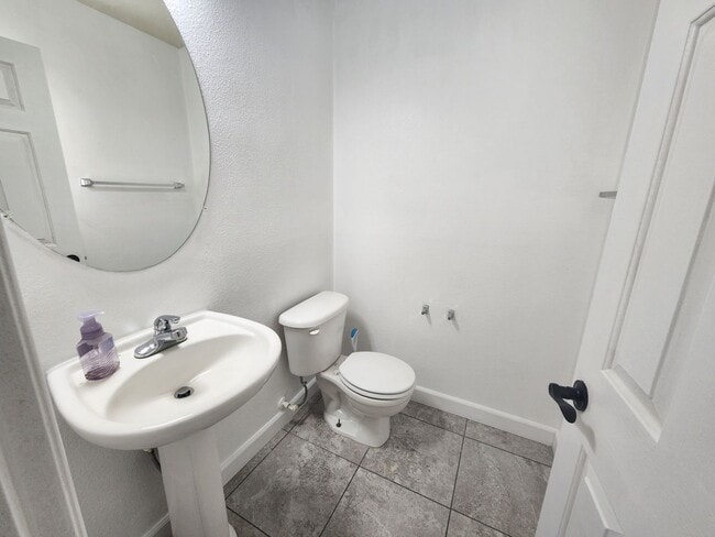 Photo - Sleek 2 story home with tile in most living areas and upgraded kitchen.