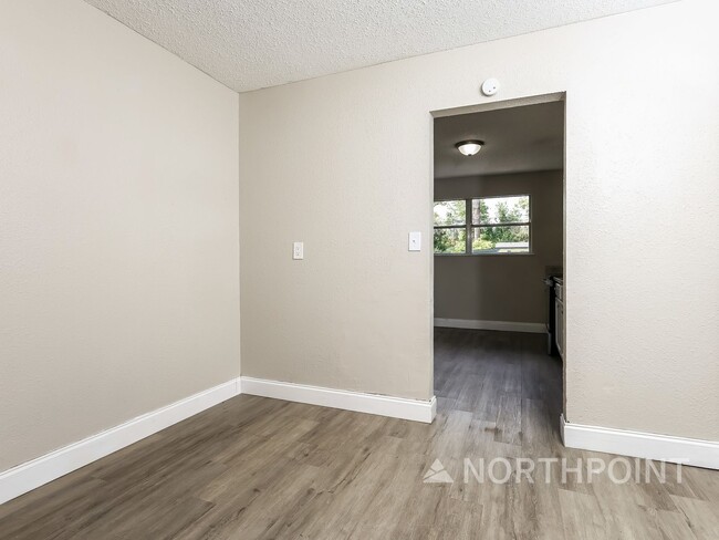 Photo - 3 BR/1BA | Newly Renovated Single Family Home | Screened in Patio and carpot | Huge backyard!